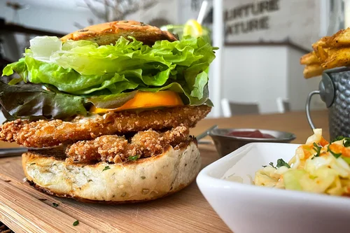 fried chicken burger with cheese and lettuce
