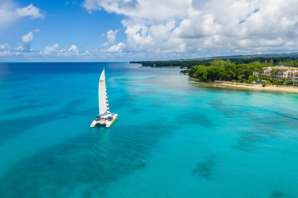 catamaran on beautiful blue ocean next to beach