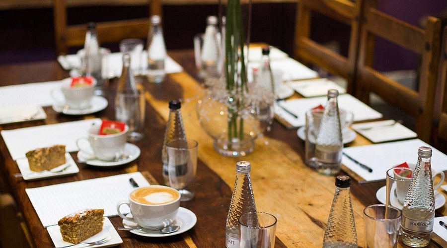 glasses and plates on a laid out table