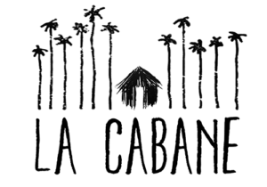 la cabane logo with palm trees surrounding a hut