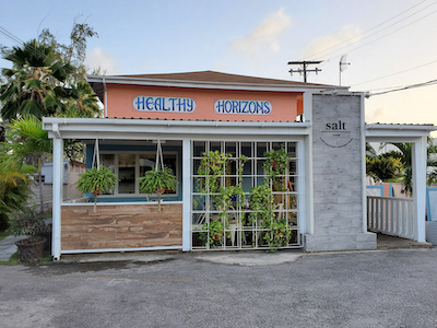 outside salt café with the name on an orange wall above the entrance