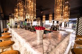 red bar stool in restaurant seating area on marble floor