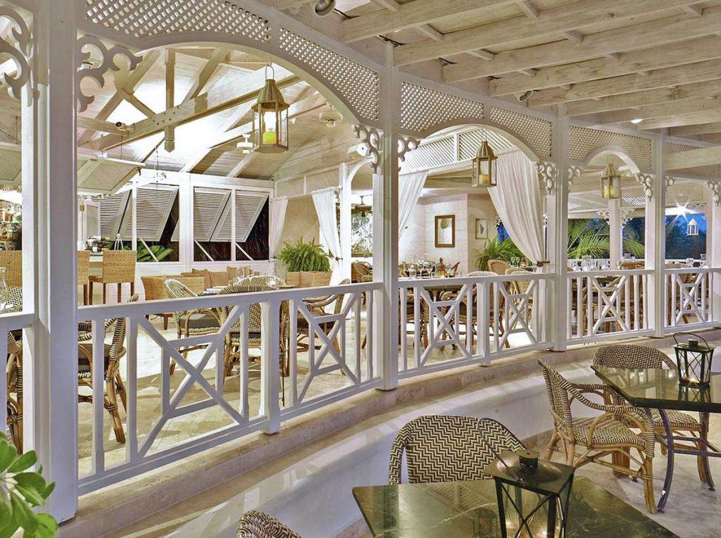 chairs along a deck with a white wooden building covering the restaurant area