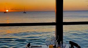 sunset view on the sea with table next to the window