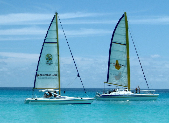 two catamarans alongside on the open ocean